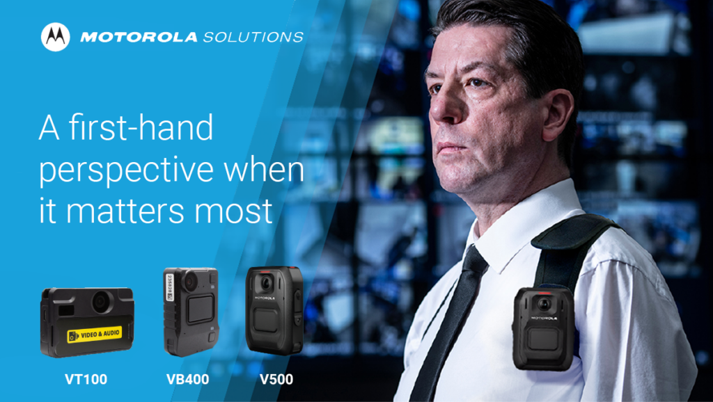 Motorola Solutions banner showcasing the Body Worn Camera products. The Motorola Solutions logo is top left, with "A first-hand perspective when it matters most" underneath. Below that are pictures of the VT100, VB400 and V500 body worn cameras. On the right is a photo of a man wearing the VB500 BWC over his work shirt.